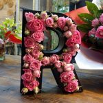 Box of a letter among the flowers